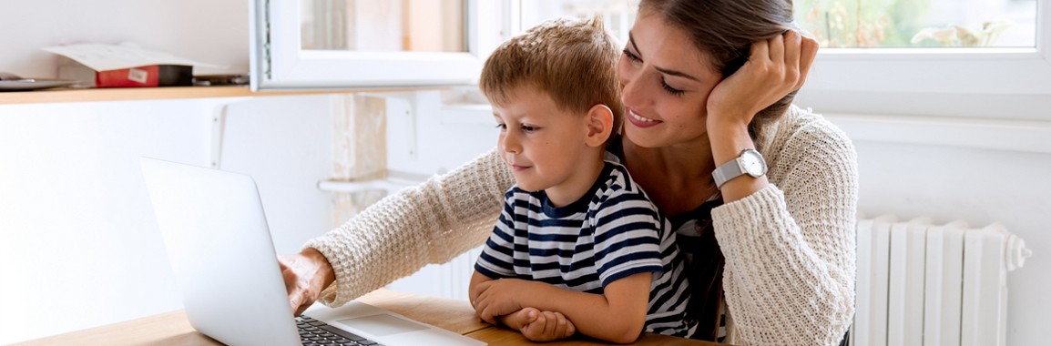 Mother with her child using a computer.
